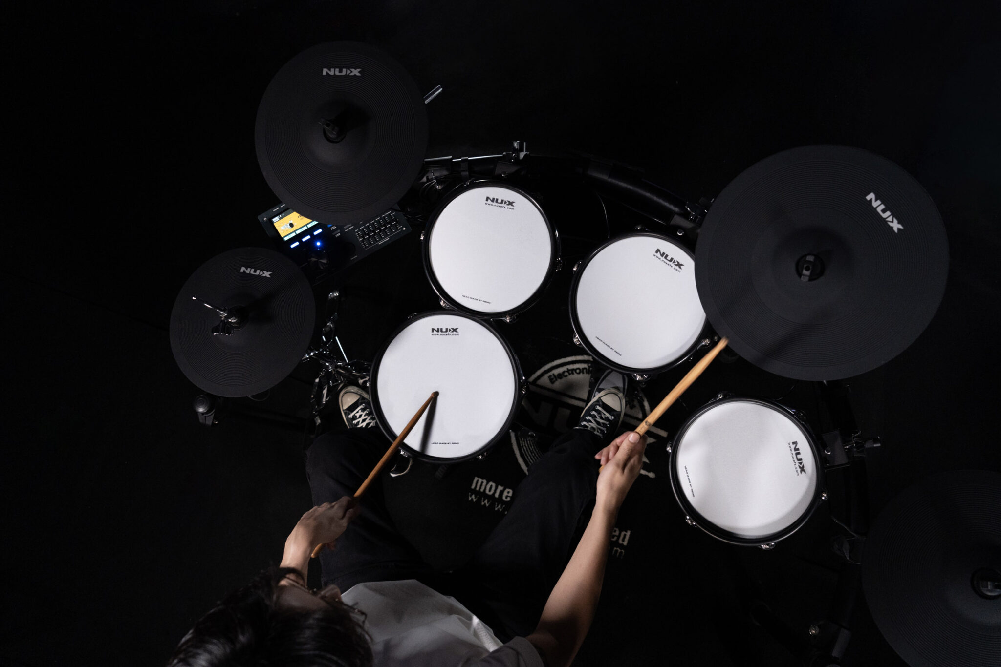 Overhead playing view of the NUX DM-8 electronic drum kit