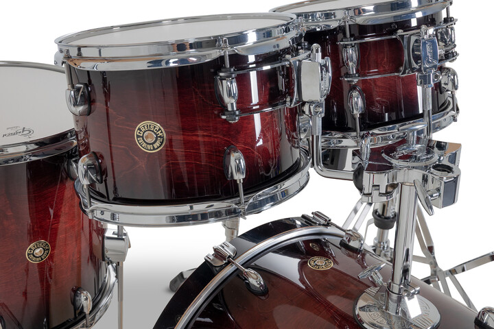 Gretsch Catalina Maple toms in Deep Cherry Burst with triple-flanged hoops and round badge