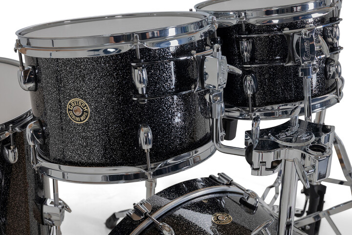 Gretsch Catalina Maple toms in Black Stardust with triple-flanged hoops and round badge